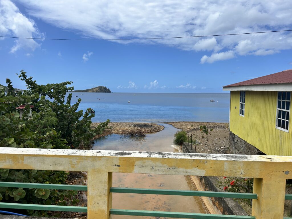 View from the bridge overlooking a polluted Alum Stream in Soufriere, Dominica