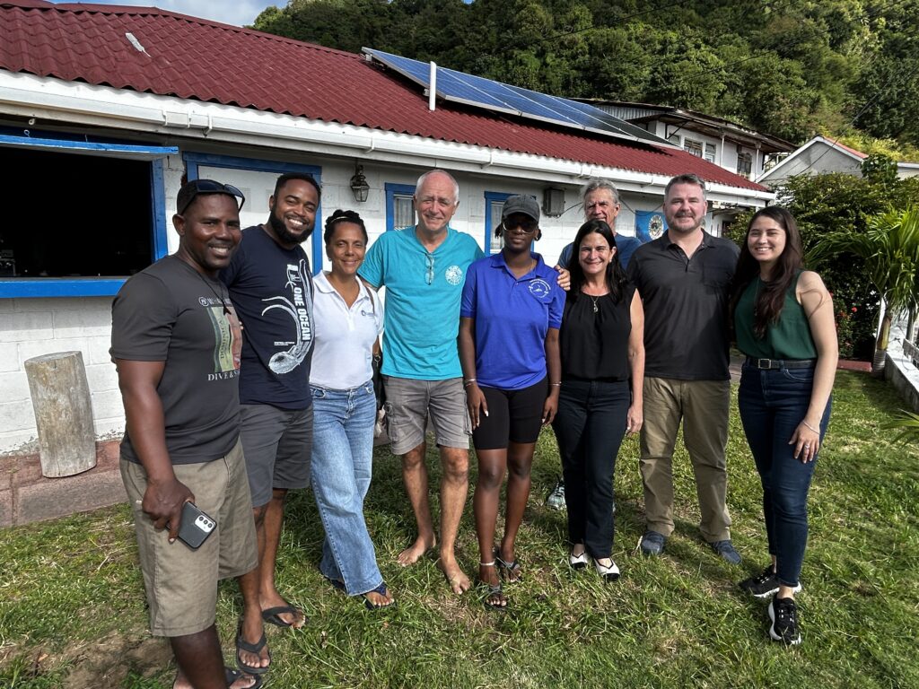 CORAL staff joins for a group photo of community members dedicated to saving coral reefs 